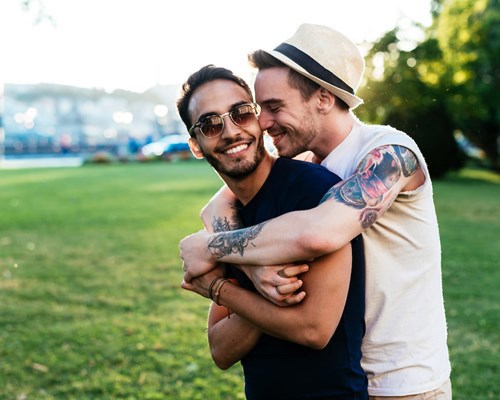Two men hugging
