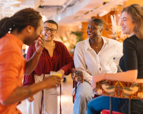 A groups of adults enjoying socialising