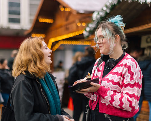 Two young people enjoying each other's company in an outdoor setting