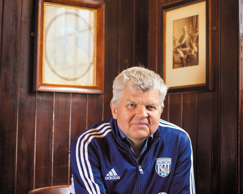 Adrian Chiles sitting in a pub
